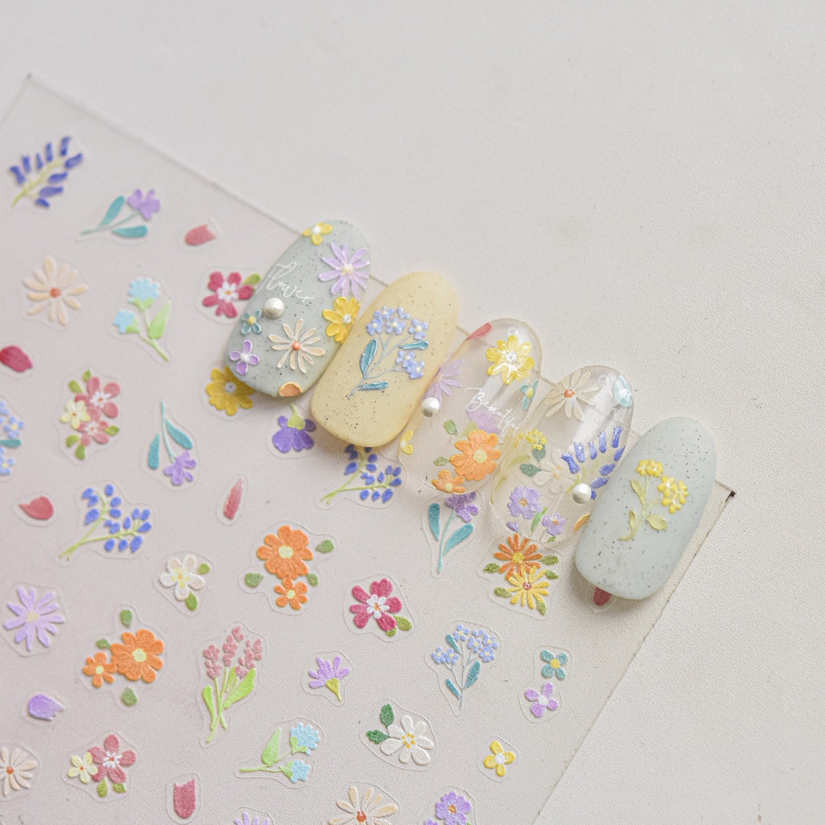 Nails with floral designs on a sticker  with flower patterns