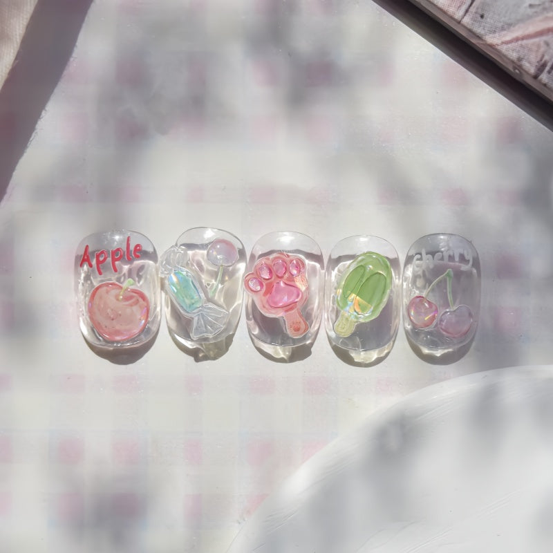 Set of clear nail polish with fruit designs 