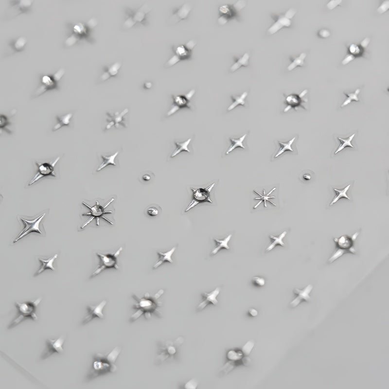 Pattern of silver star-shaped embellishments on a nail stickers