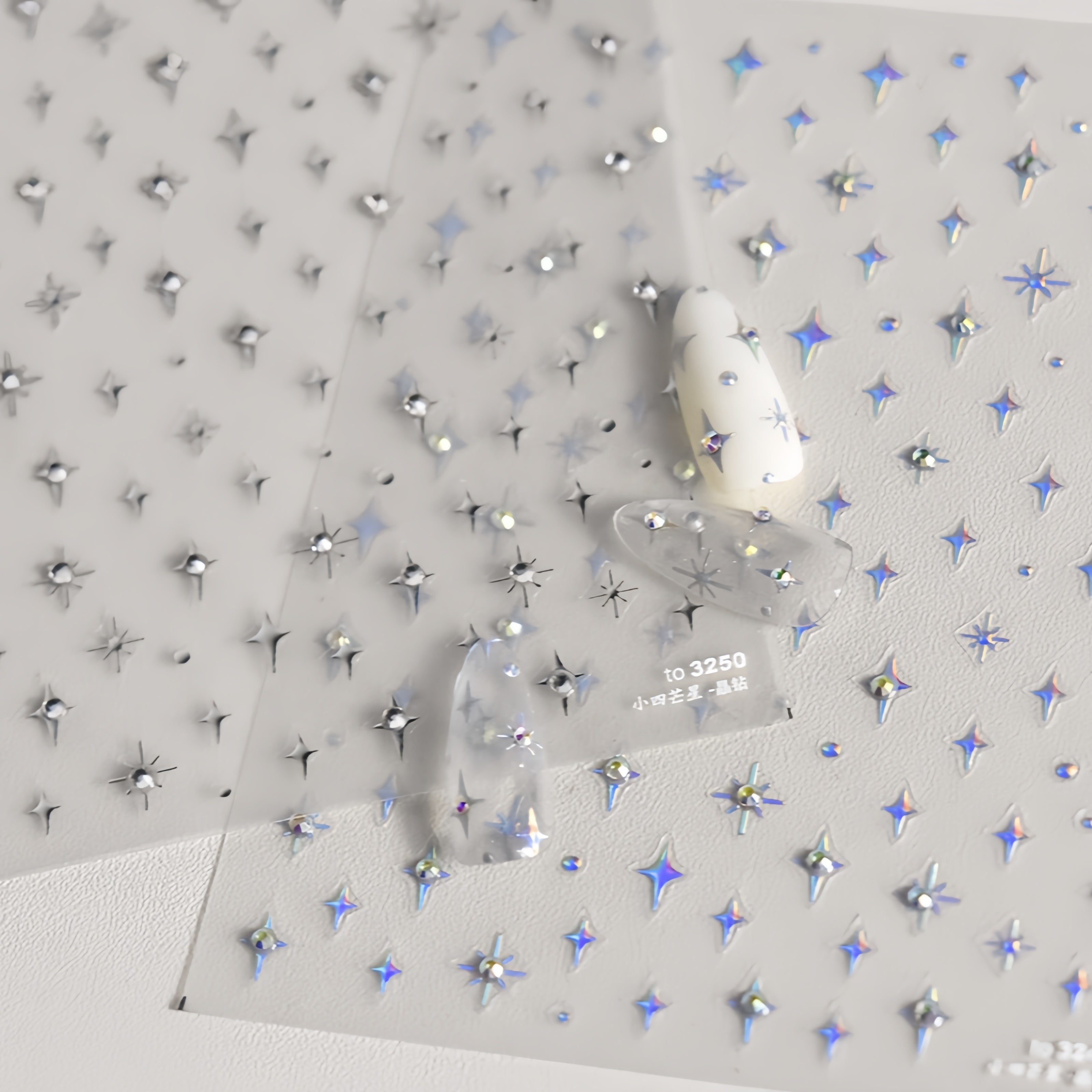  with star-shaped rhinestone nail decorations